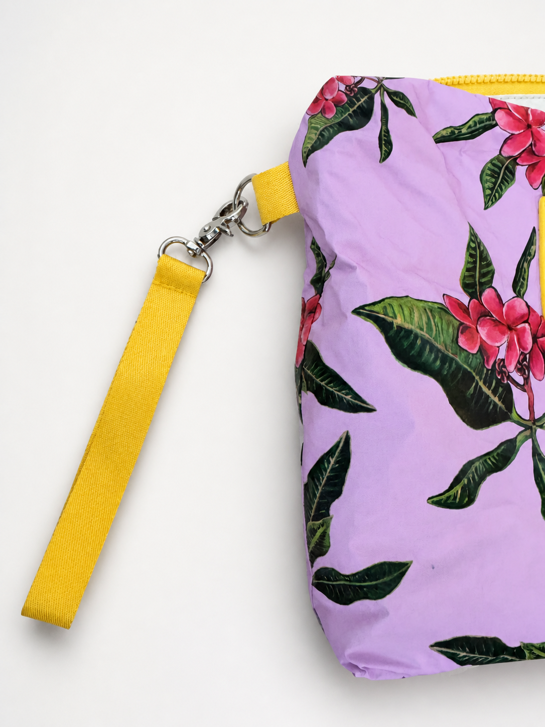 Full removable yellow wristlet and silver hardware detail