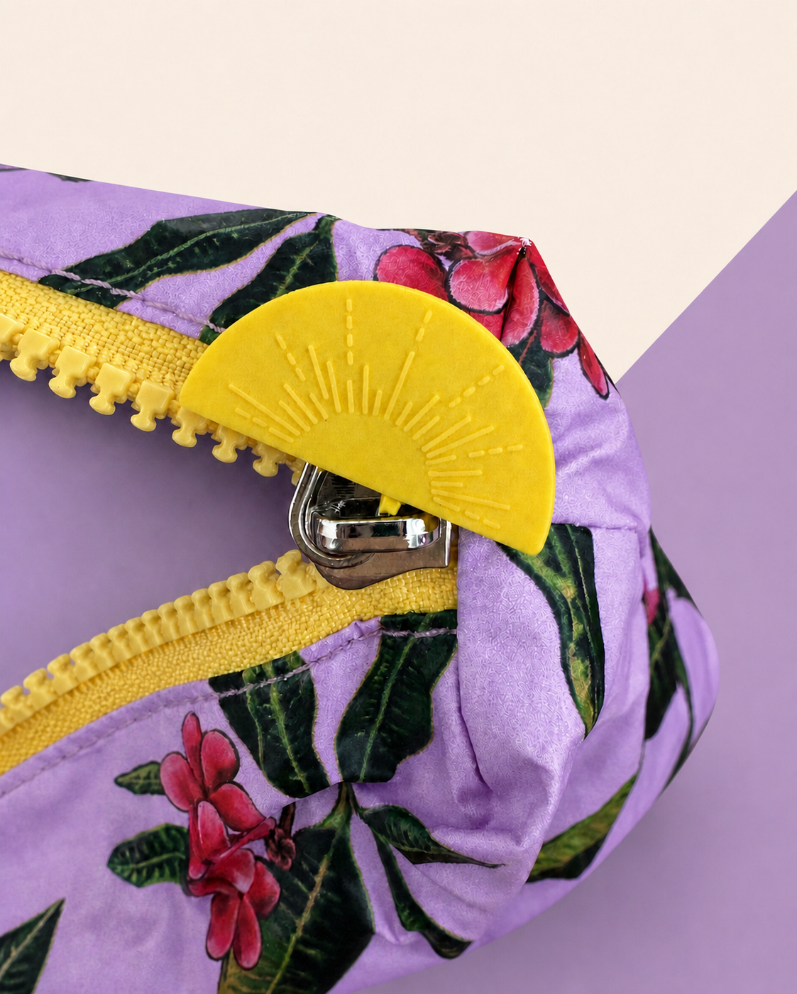 Close-up of signature yellow sunrise zipper pull