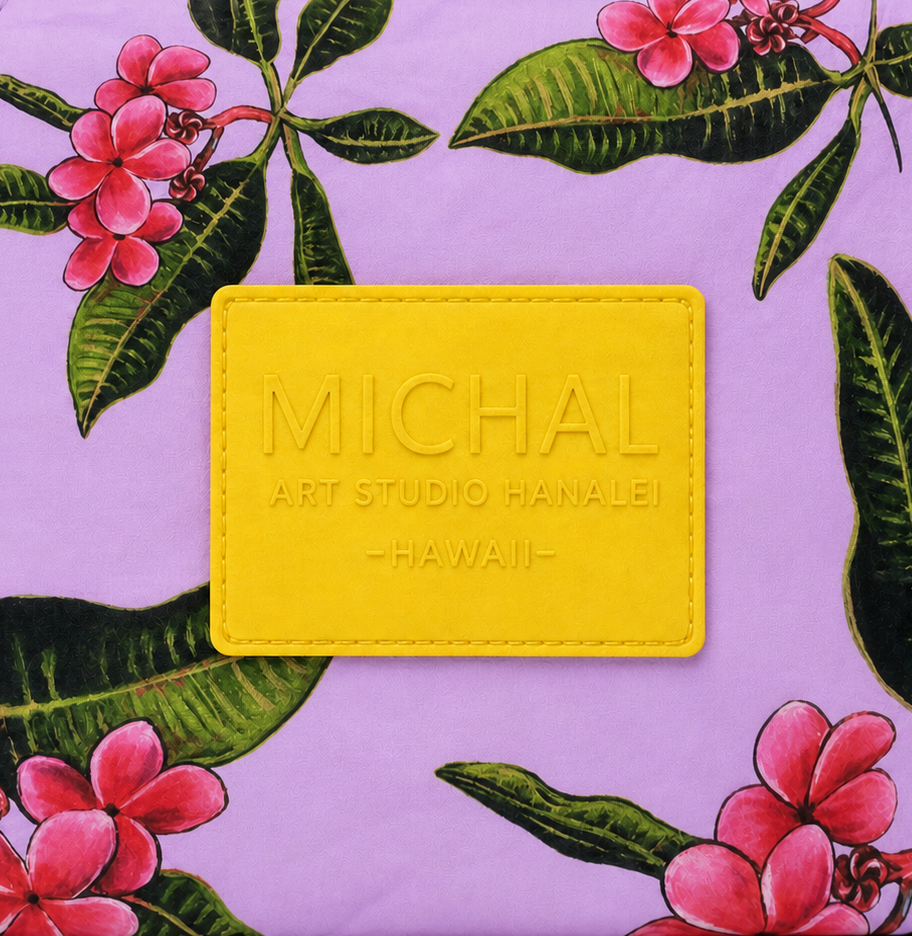 Yellow-on-yellow embossed Michal Art Studio Hanalei patch detail